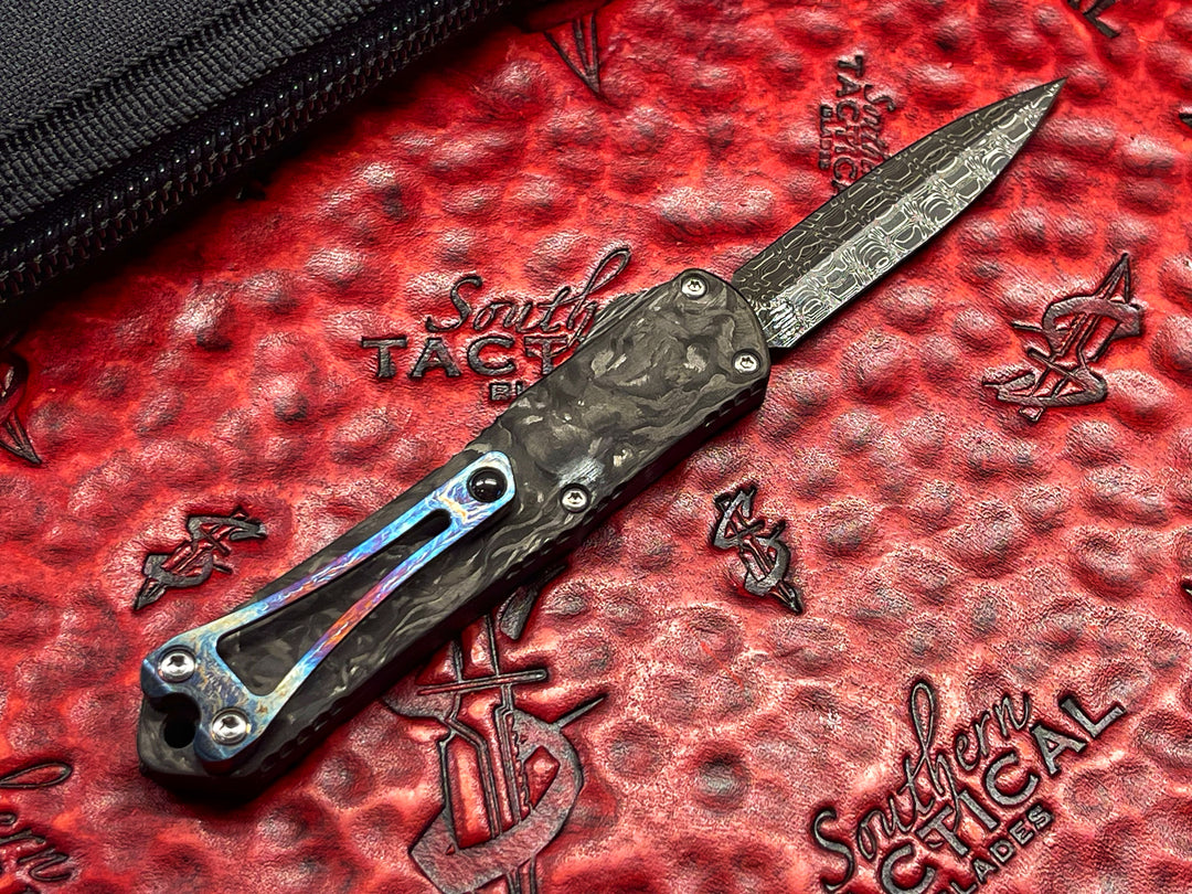Heretic Knives Custom Manticore S, Hand Ground Double Edge, Vegas Forge Damascus, DLC Stainless Steel w/ Marbled Carbon Fiber Inlay, Marbled Carbon Fiber Back cover