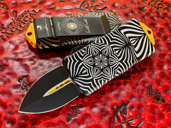 Microtech Exocet Double Edge, Two Toned Black w/ Gold Accents, Aircraft Allow w/ ‘Source’ Artwork