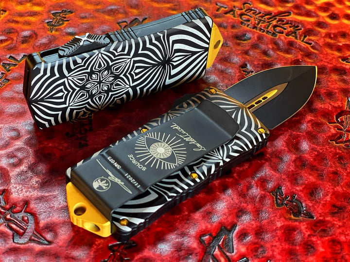 Microtech Exocet Double Edge, Two Toned Black w/ Gold Accents, Aircraft Allow w/ ‘Source’ Artwork