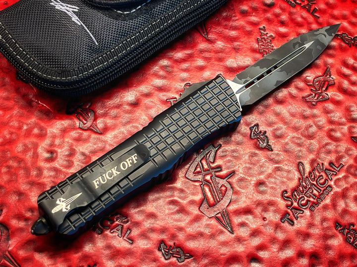 MARFIONE “Fuck Off” Combat Troodon Delta Frag, Double Edge Full Serrated, Urban Camo Cerakote Accents, Double Action OTF Knife