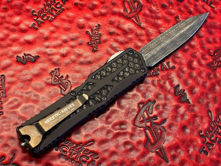 Heretic Knives Colossus, Hand Ground Double Edge, Vegas Forge Reptilian Damascus, Anodized Aluminum, Black Python Inlays, DLC Hardware, Double Action OTF Knife