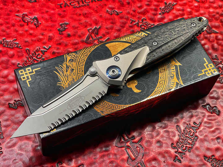 Microtech Socom Bravo Tanto Edge, Full Serrated Bead Blast Finish Titanium Handle with Carbon Fiber Scales- Blue Pivot Collar. Full Serrations By Anthony (Tony) Marfione