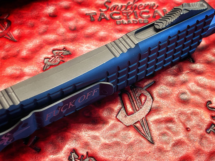MARFIONE “Fuck Off” Combat Troodon Delta Frag, Double Edge Full Serrated, Urban Camo Cerakote Accents, Double Action OTF Knife