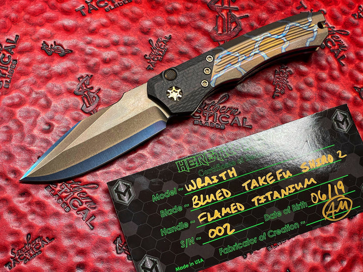 Heretic knives Wraith Auto OTS, Blued Takefu Shiro 2 San Mai, Carbon Fiber Bolster, Flamed Titanium w/ Bronze Titanium Accents