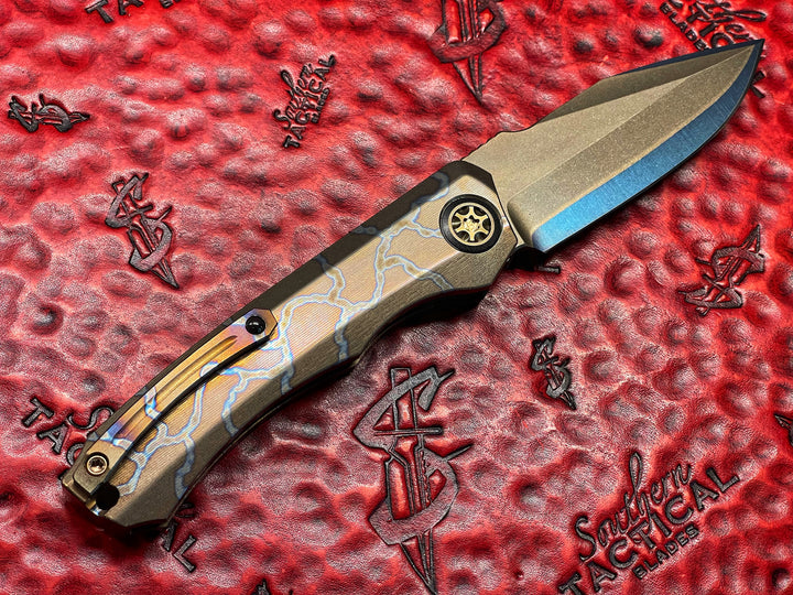 Heretic knives Wraith Auto OTS, Blued Takefu Shiro 2 San Mai, Carbon Fiber Bolster, Flamed Titanium w/ Bronze Titanium Accents