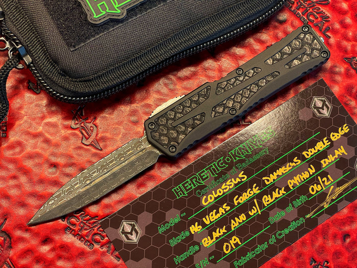 Heretic Knives Colossus, Hand Ground Double Edge, Vegas Forge Reptilian Damascus, Anodized Aluminum, Black Python Inlays, DLC Hardware, Double Action OTF Knife