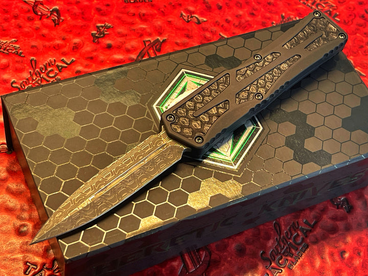 Heretic Knives Colossus, Hand Ground Double Edge, Vegas Forge Reptilian Damascus, Anodized Aluminum, Black Python Inlays, DLC Hardware, Double Action OTF Knife