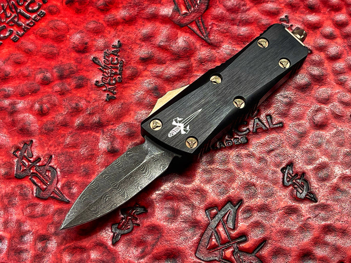 Marfione Custom Mini Troodon, Double Edge Spike Grind, Sharktooth Pattern Vegas Forge Damascus, Bronzed Ringed Accents