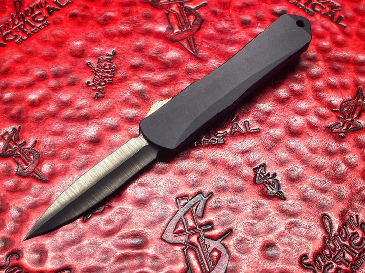 Heretic Knives Manticore S, Hand Ground Double Edge DLC, Black Anodized Alloy, Marbled Carbon Fiber Back Cover, DLC Hardware, Flamed Ti Button, Double Action OTF Knife