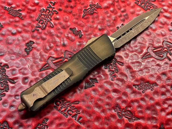 Microtech Combat Troodon Double Edge Bronze Apocalyptic Full Serrated Antique Bronze Signature Series Double Action OTF Knife