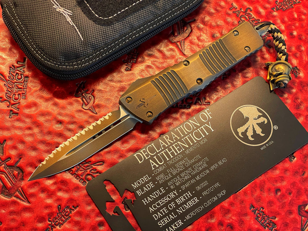 Marfione Custom Combat Troodon, Memento Mori, Double Edge, Full Serrated, Antique Bronze Cerakote w/  Matching Hardware, Spartan Meadow Viper Bead, Double Action OTF Knife 1 of 1