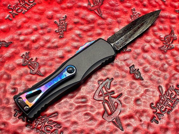 Marfione Custom Hera, Double Edge Spike Grind, Hot Blued Vegas Forge Reptilian Pattern Damascus, Anodized Alloy, Zurcuti Button and Pocket Clip, Two Tone DLC Hardware