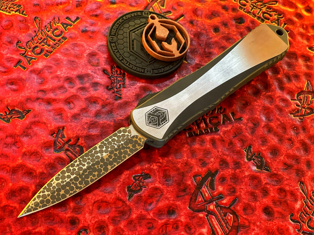 Heretic Knives Manticore E Double Edge, Hand Ground Vegas Forge Ball Bearing Damascus, Two Tone DLC Stainless Steel, Carbon Fiber Button, Bronze Ti Accents, Entropic Ti Clip