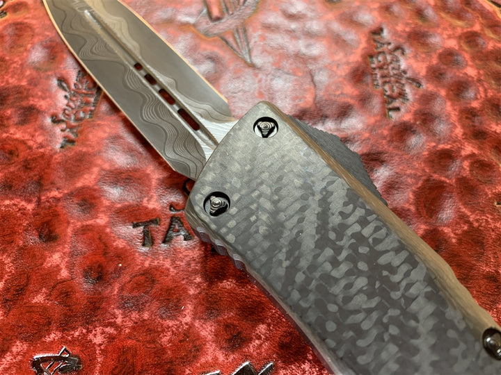 Marfione Custom Knives Combat Troodon Double Edge Chad Nichols CTX XHP Core Damascus, Carbon Fiber Top and Button, Hefted Aluminum Chassis, DLC Ringed Hardware